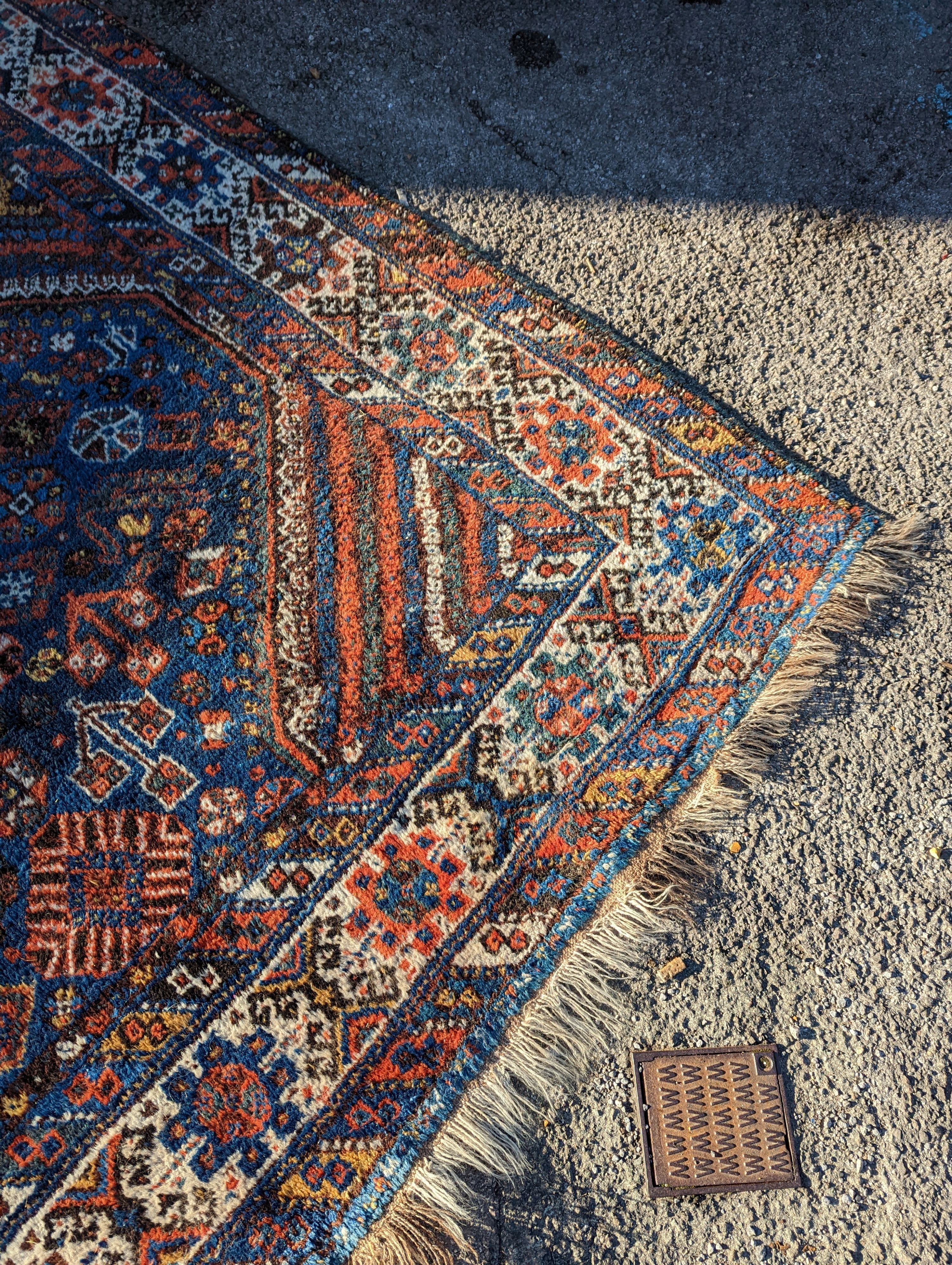 A Shirvan blue ground carpet, 315 x 222cm